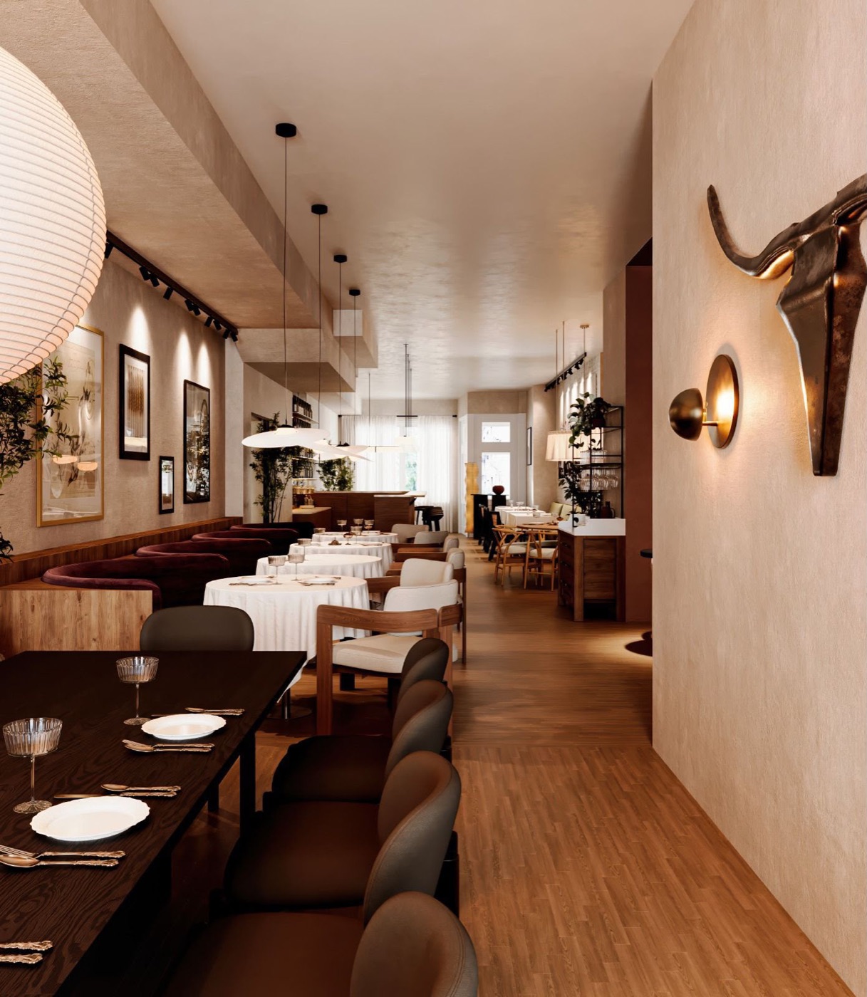 Dining room seen from the entrance, tables dressed in white linen